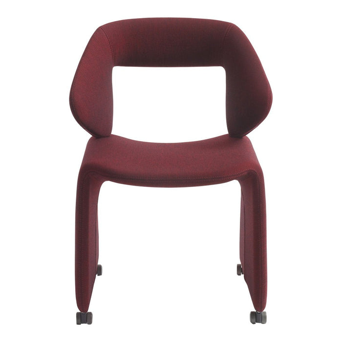 Burgundy upholstered chair with a sleek modern design and smooth, curved lines, perfect for contemporary settings.