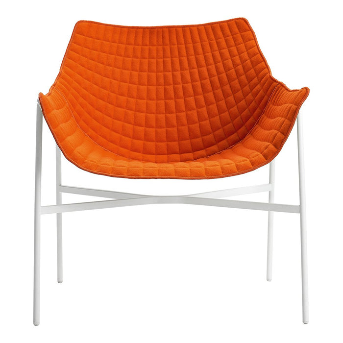 Orange quilted chair with white metal legs, featuring a modern and stylish design for contemporary interiors.