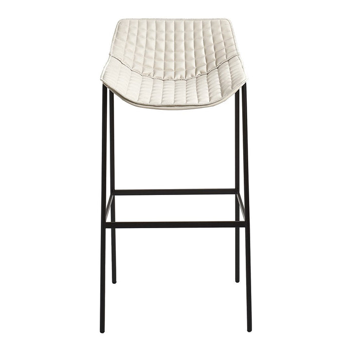 Cream quilted bar stool with black metal legs, featuring a modern and minimalist design.
