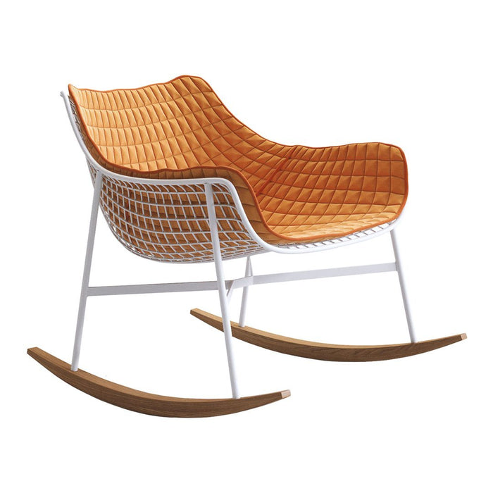 Orange quilted rocking chair with a white frame and wooden rockers, featuring a modern, contemporary design.
