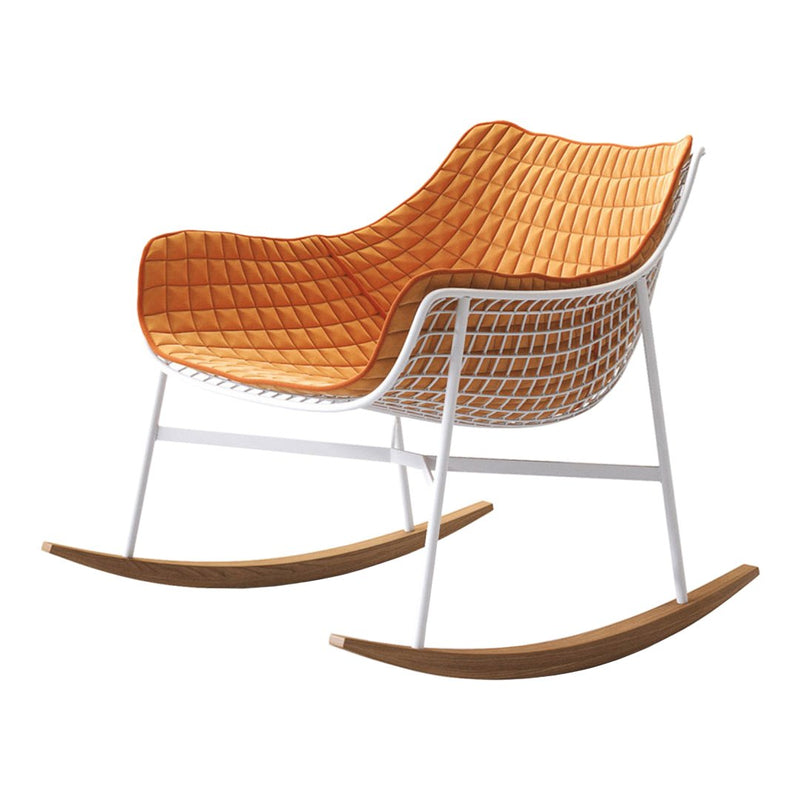 Orange quilted cushion on a white metal frame with natural wood rocker base. Modern design with vibrant color.