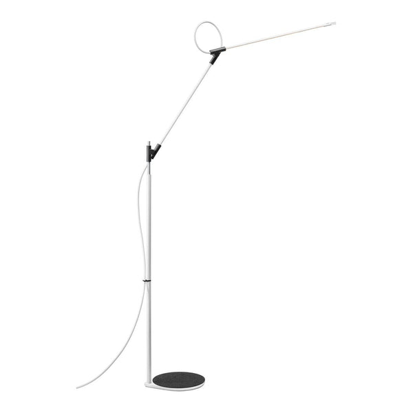 Sleek modern floor lamp featuring a white stem, black base, and minimalistic design for a contemporary look.