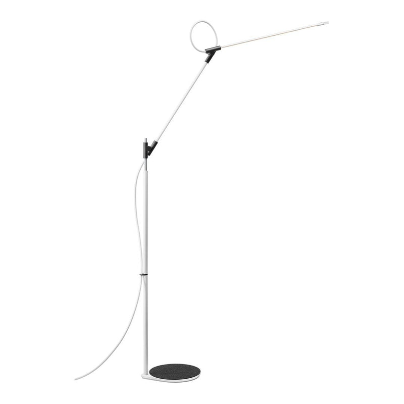 Sleek modern floor lamp featuring a white stem, black base, and minimalistic design for a contemporary look.