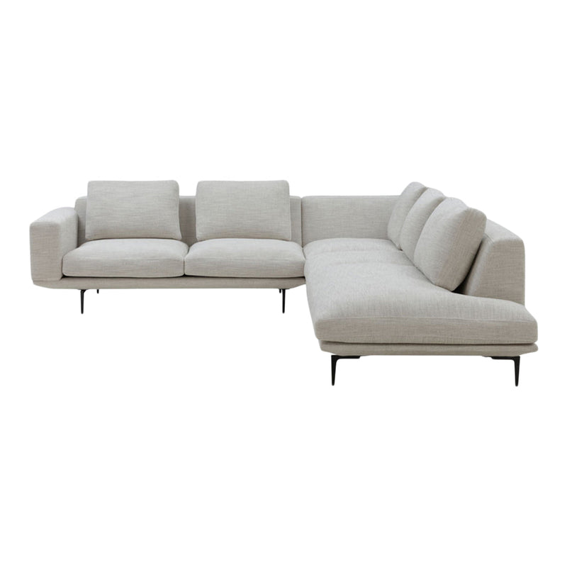 Light beige sectional sofa with a minimalist design and plush cushions, ideal for modern living spaces.
