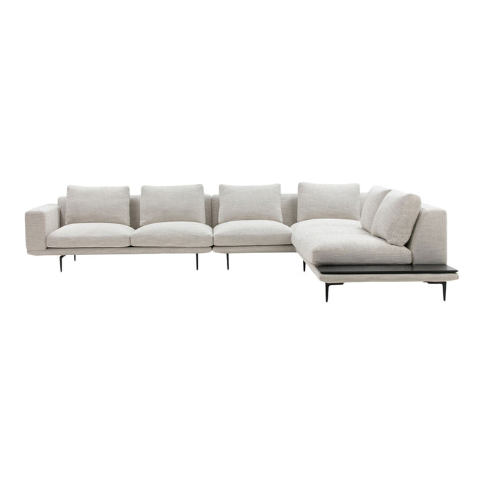 Light beige sectional sofa with soft, textured fabric, featuring clean lines and minimalist design.