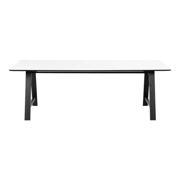 Elegant white tabletop with sleek black legs, showcasing a modern, minimalist design perfect for any decor.