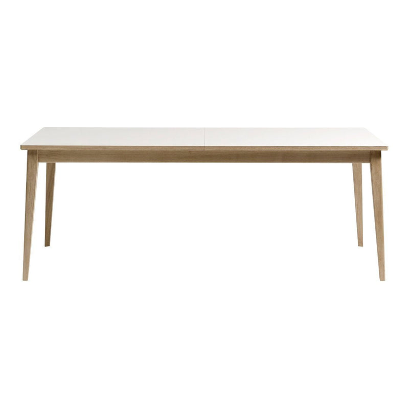 Light-colored wooden dining table with a smooth surface and tapered legs, showcasing a minimalist design.