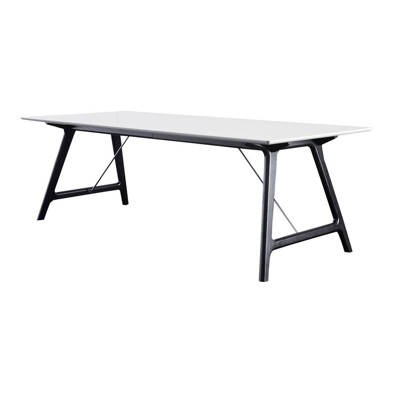 Modern rectangular table with a sleek white top and black legs, featuring a minimalist design. Perfect for contemporary spaces.