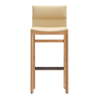Beige leather bar stool with light wood frame and dark wood footrest, featuring a minimalist design.