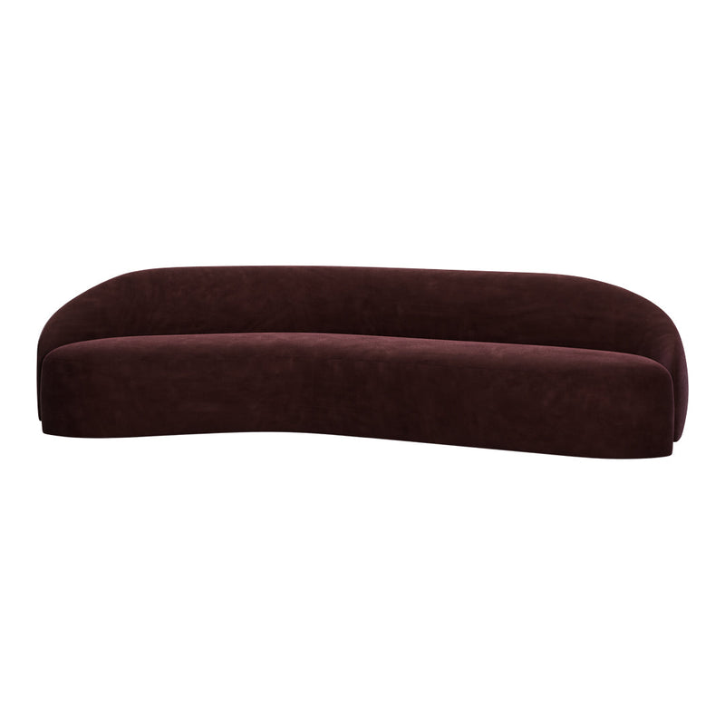 Curved sofa in deep burgundy velvet with a smooth, modern silhouette and rich texture for a luxurious look.