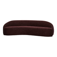 Curved sofa in rich burgundy velvet, showcasing a smooth, soft texture and modern, minimalist design.