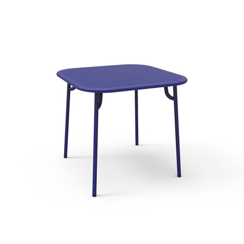Square purple table with a smooth surface and sleek metal legs, perfect for modern decor. Ideal for indoor or outdoor use.