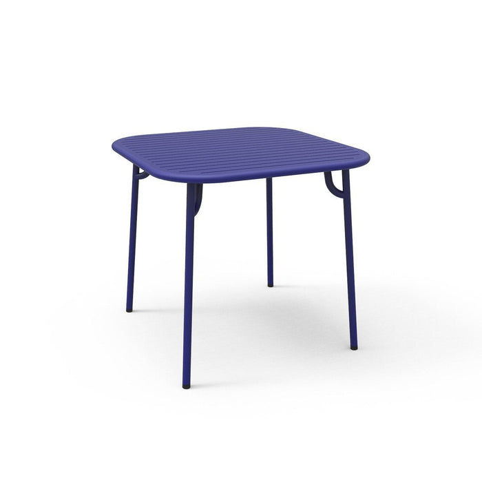Square purple table with a smooth surface and sleek metal legs, perfect for modern decor. Ideal for indoor or outdoor use.