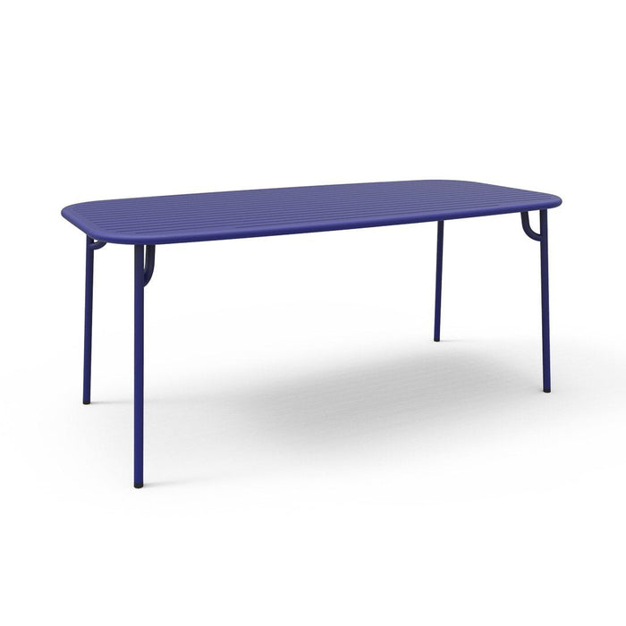 Blue rectangular table with a smooth surface and sleek metal legs, perfect for modern decor.