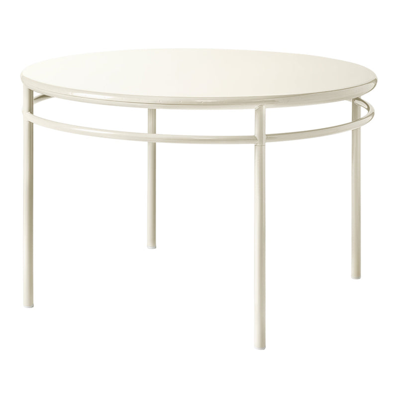 Round white table with smooth finish and minimalist design, supported by sleek, light-colored metal legs.