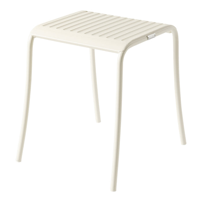 Light cream-colored stool with a slatted top and smooth, curved legs, ideal for modern decor.