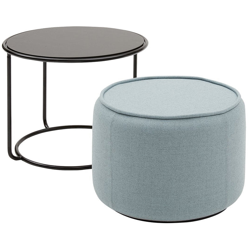 Round black table with a sleek metal frame and soft blue upholstered ottoman with a smooth texture. Modern design elements.
