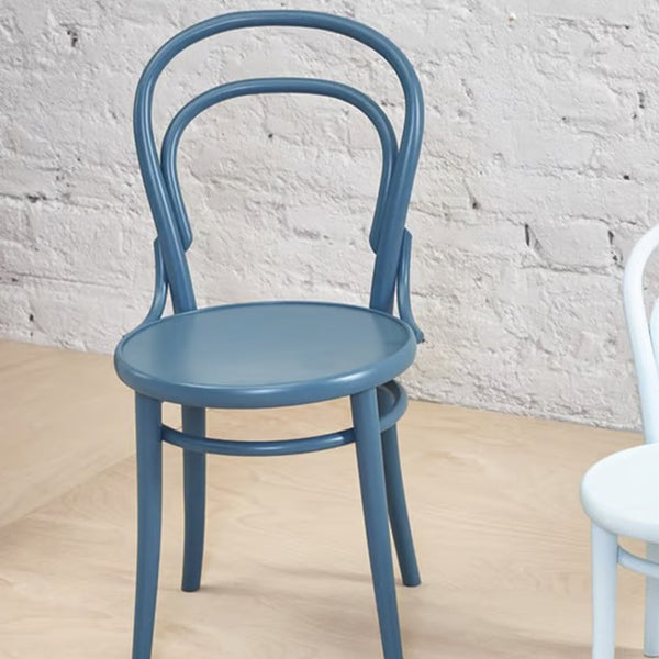 Blue bentwood chair with a smooth finish and minimalist design, featuring simple curves and a solid round seat.