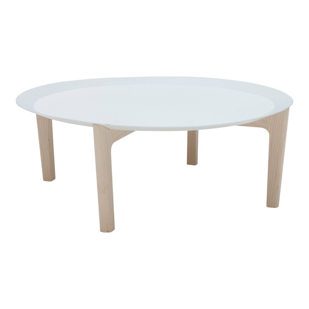 Round coffee table with a sleek white top and natural wooden legs, featuring a minimalistic, modern design.
