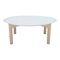 Round coffee table with a sleek white top and natural wood legs, showcasing a minimalist design with a modern aesthetic.