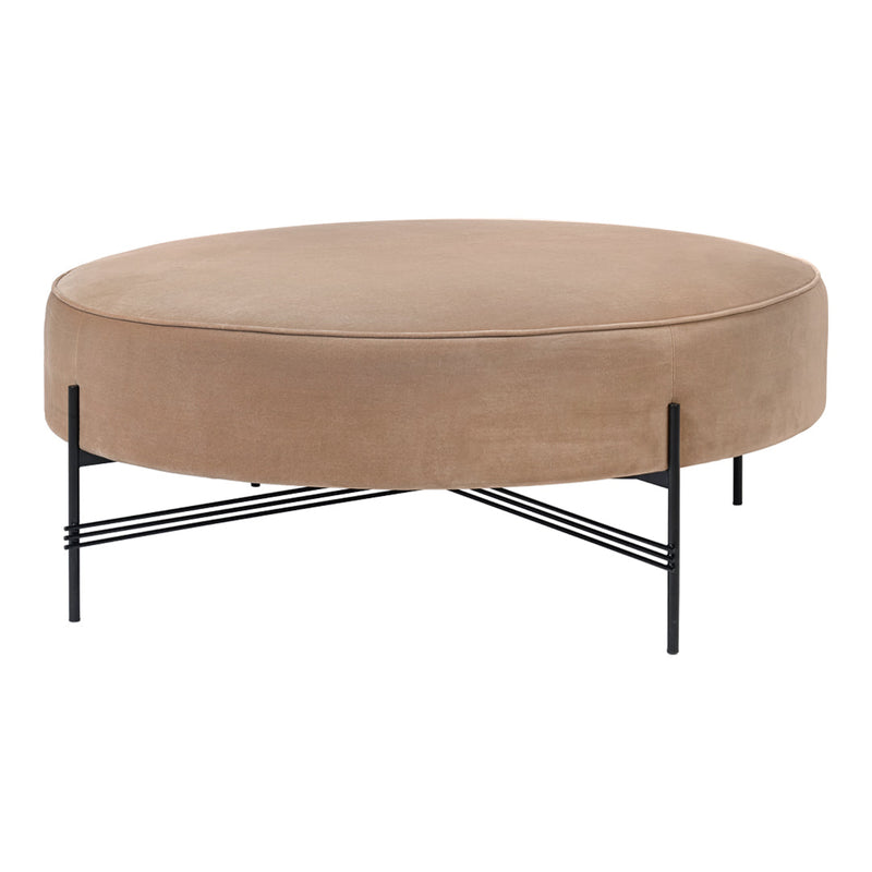 Round beige velvet ottoman with a sleek black metal base, featuring a smooth texture and modern design.
