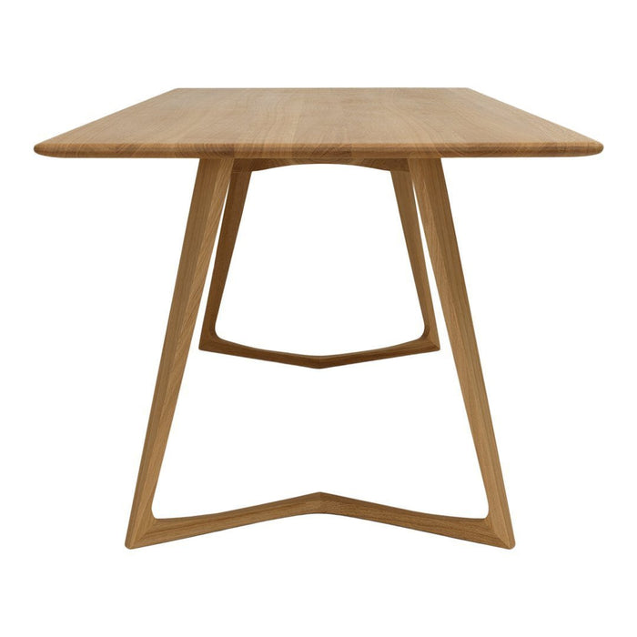 Natural wood dining table with a smooth, light oak finish and minimalist design. Ideal for modern interiors.