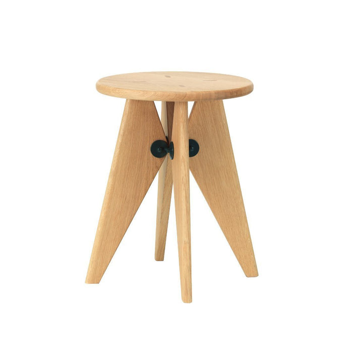 Light oak round side table with triangular legs and black accent details. Minimalist design with natural wood finish.
