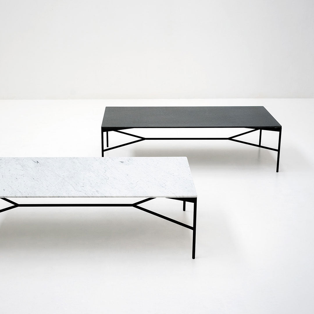 "Modern coffee tables in sleek black and white marble finishes with minimalist black metal frames."