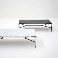 "Modern coffee tables in sleek black and white marble finishes with minimalist black metal frames."