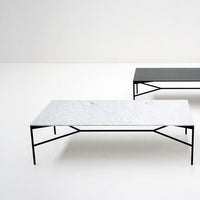 Stylish coffee tables featuring a white patterned marble top and a sleek matte black surface, framed with black metal legs.
