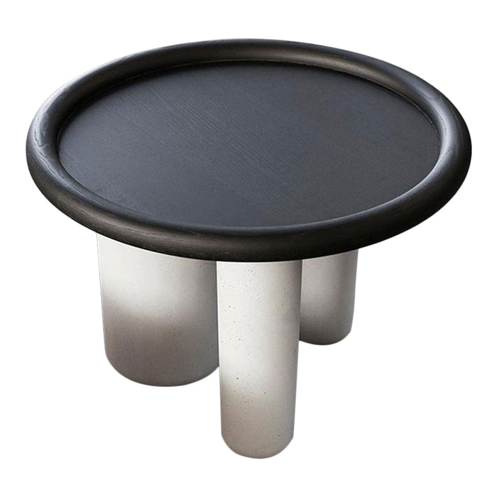 Black round tabletop with glossy finish, featuring sleek silver cylindrical legs. Modern and minimalist design.