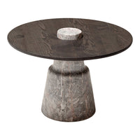 Round coffee table featuring a dark wood top and a textured gray stone base with a contrasting white center.