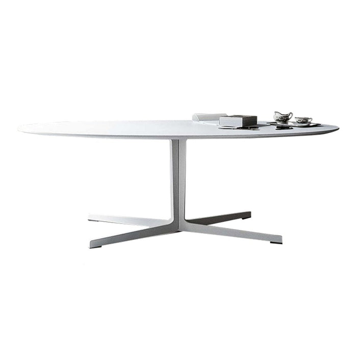 Modern oval white dining table with a sleek silver base, minimalist design, ideal for contemporary interiors.