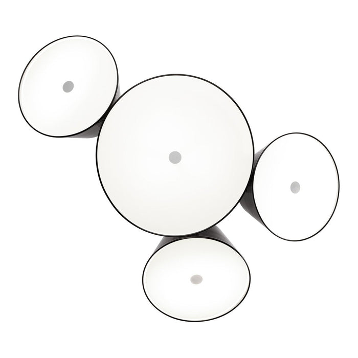 White circular lamps with black rims, featuring a modern, minimalist design in various sizes arranged artfully.