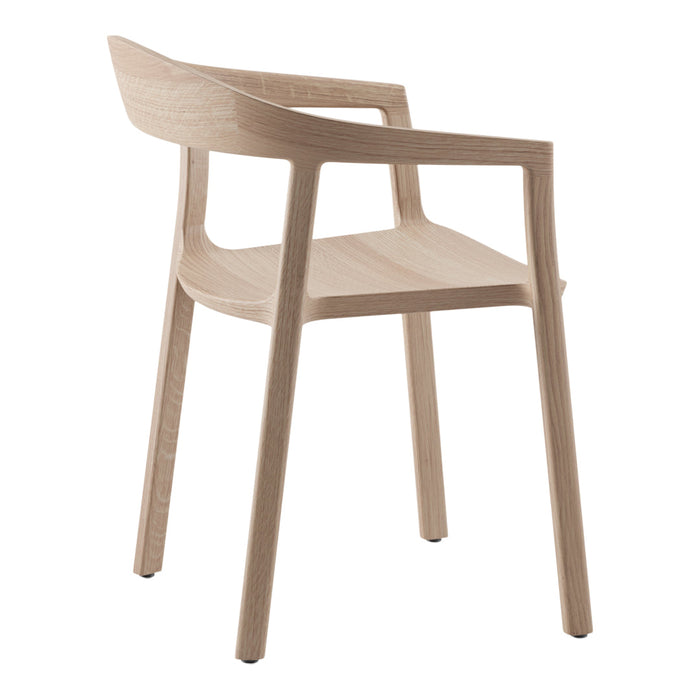 Light oak chair with a minimalist design, featuring smooth lines and natural wood grain pattern. Perfect for modern decor.