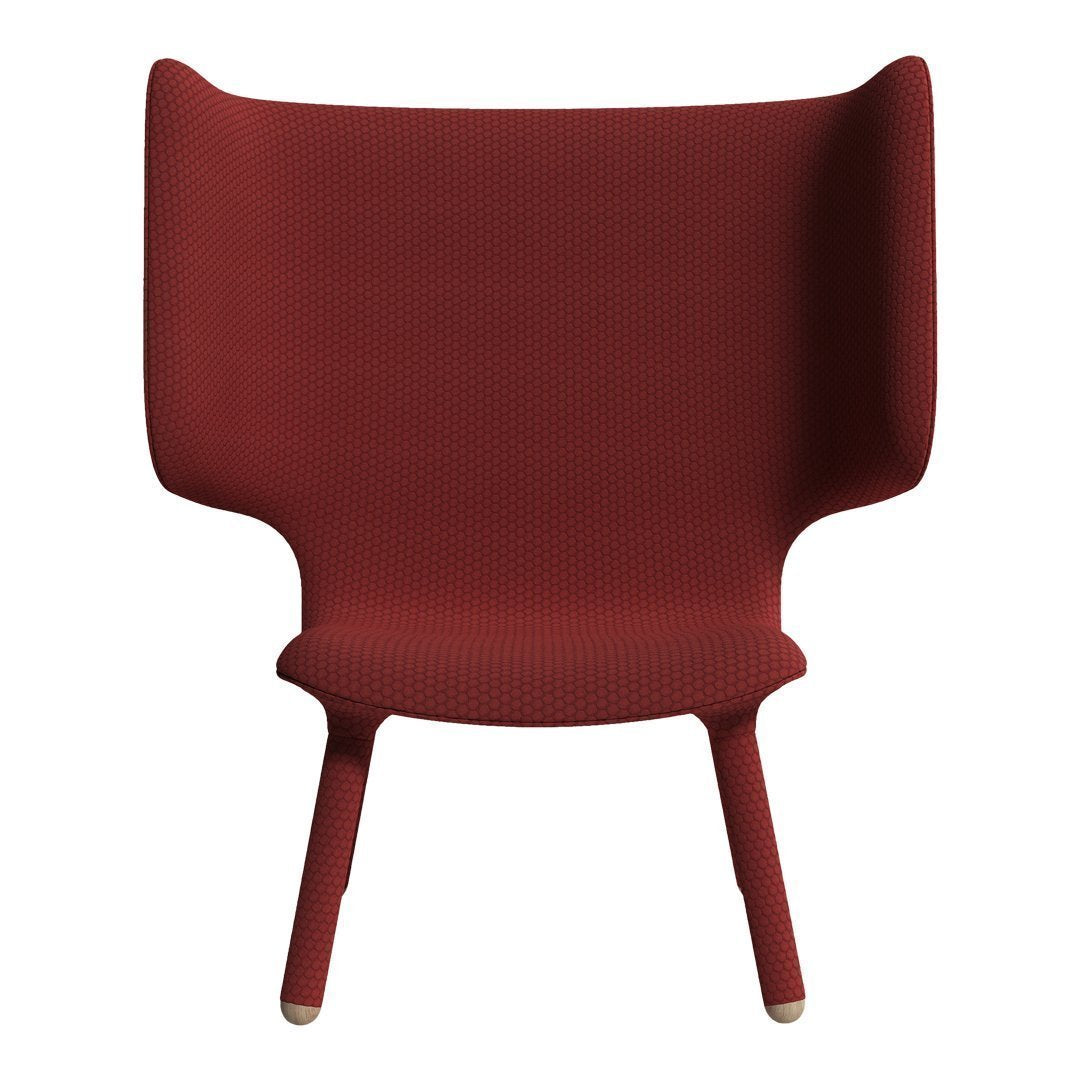 Red textured chair with high back and curved arms, featuring a minimalist design. Perfect for modern interiors.