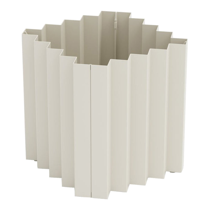 Light beige scalloped planter with a textured vertical pattern, ideal for modern decor. Perfect for indoor plants.