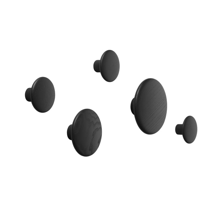 Set of five matte black wall hooks in varying sizes and smooth, round shapes. Ideal for modern decor.
