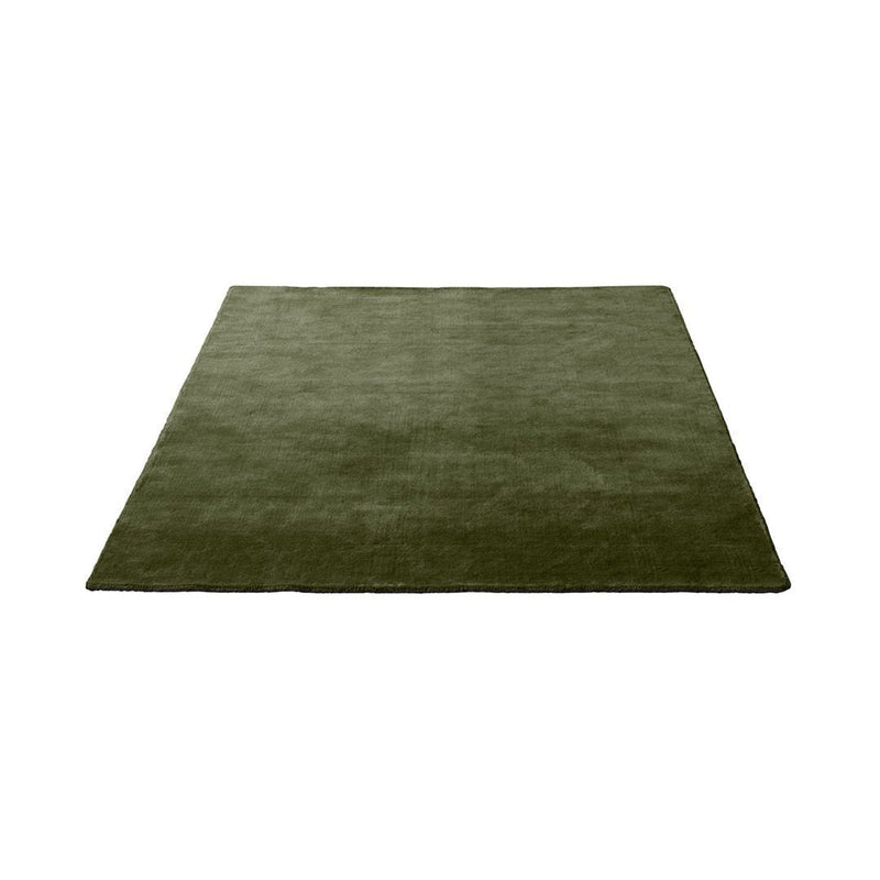 Solid olive green area rug with a smooth texture, perfect for adding a rich, earthy tone to any space.