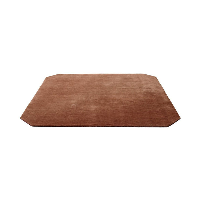 Soft brown rectangular rug with a smooth, solid texture and subtly rounded corners. Ideal for warm, cozy interiors.