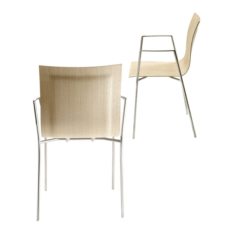 Beige woven seat with sleek silver legs, featuring a minimalist design and smooth lines. Perfect for modern decor.