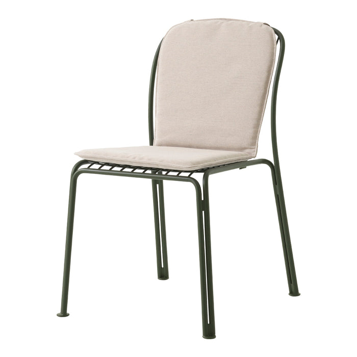 Beige cushioned seat with a sleek green metal frame, perfect for indoor or outdoor settings.