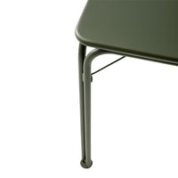Olive green table with a smooth surface and sleek, curved metal legs. Modern minimalist design.