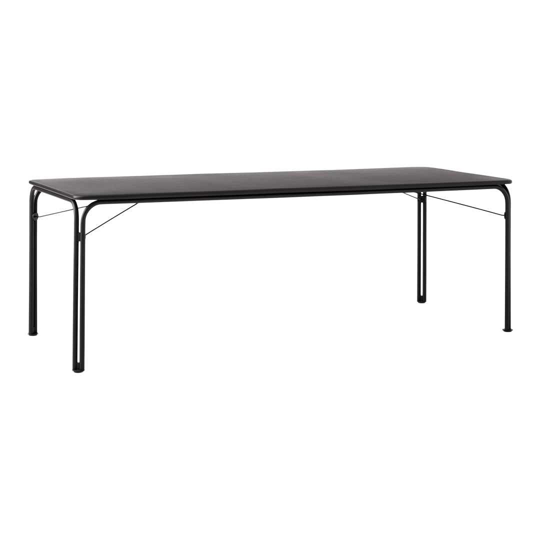 Black rectangular table with a minimalist design and sturdy metal legs. Ideal for modern spaces and versatile arrangements.