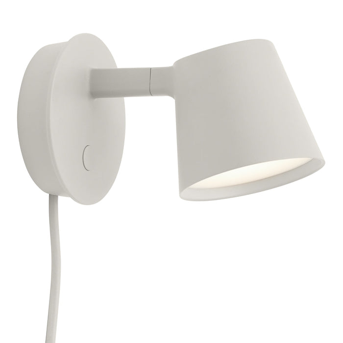 White wall lamp with a smooth, modern design and a rounded shade. Minimalist aesthetic suitable for various interiors.