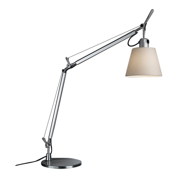Sleek silver desk lamp with a beige shade and modern, minimalist design. Perfect for any workspace.