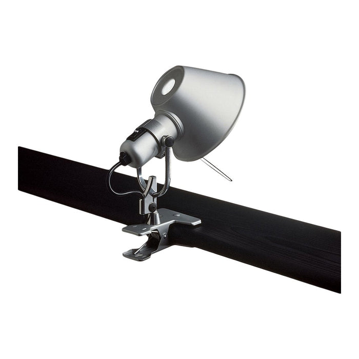 Silver spotlight with a sleek design, mounted on a black track for modern lighting solutions.