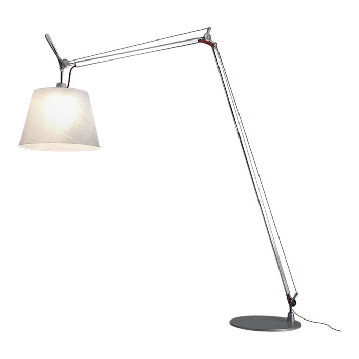 Modern floor lamp with a sleek silver frame, white fabric shade, and red accents, creating a contemporary design.