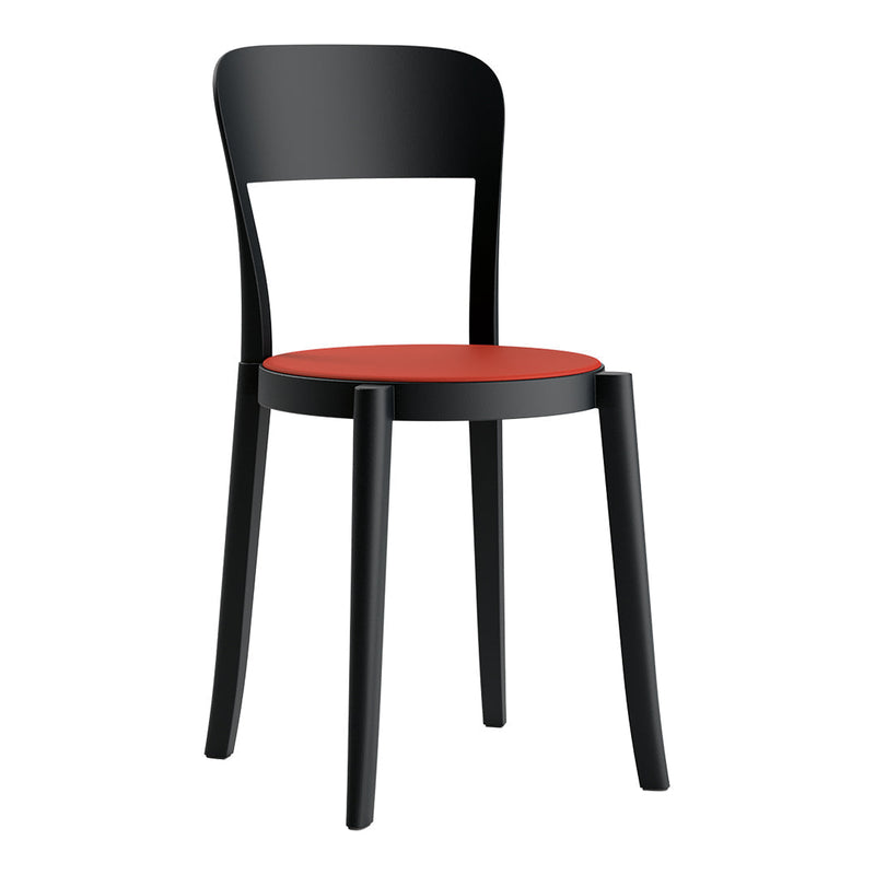 Black chair with a sleek design and vibrant red seat, perfect for modern interiors.
