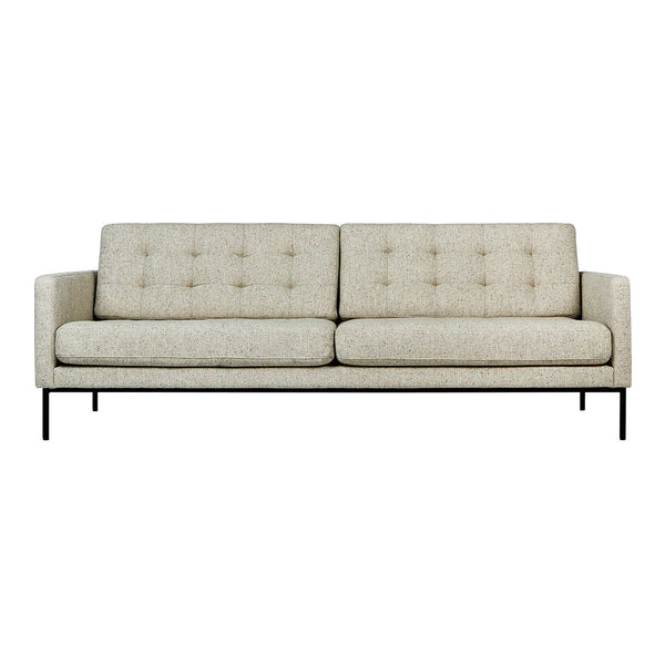 Light beige sofa with subtle tufted pattern and sleek black metal legs, perfect for modern decor.